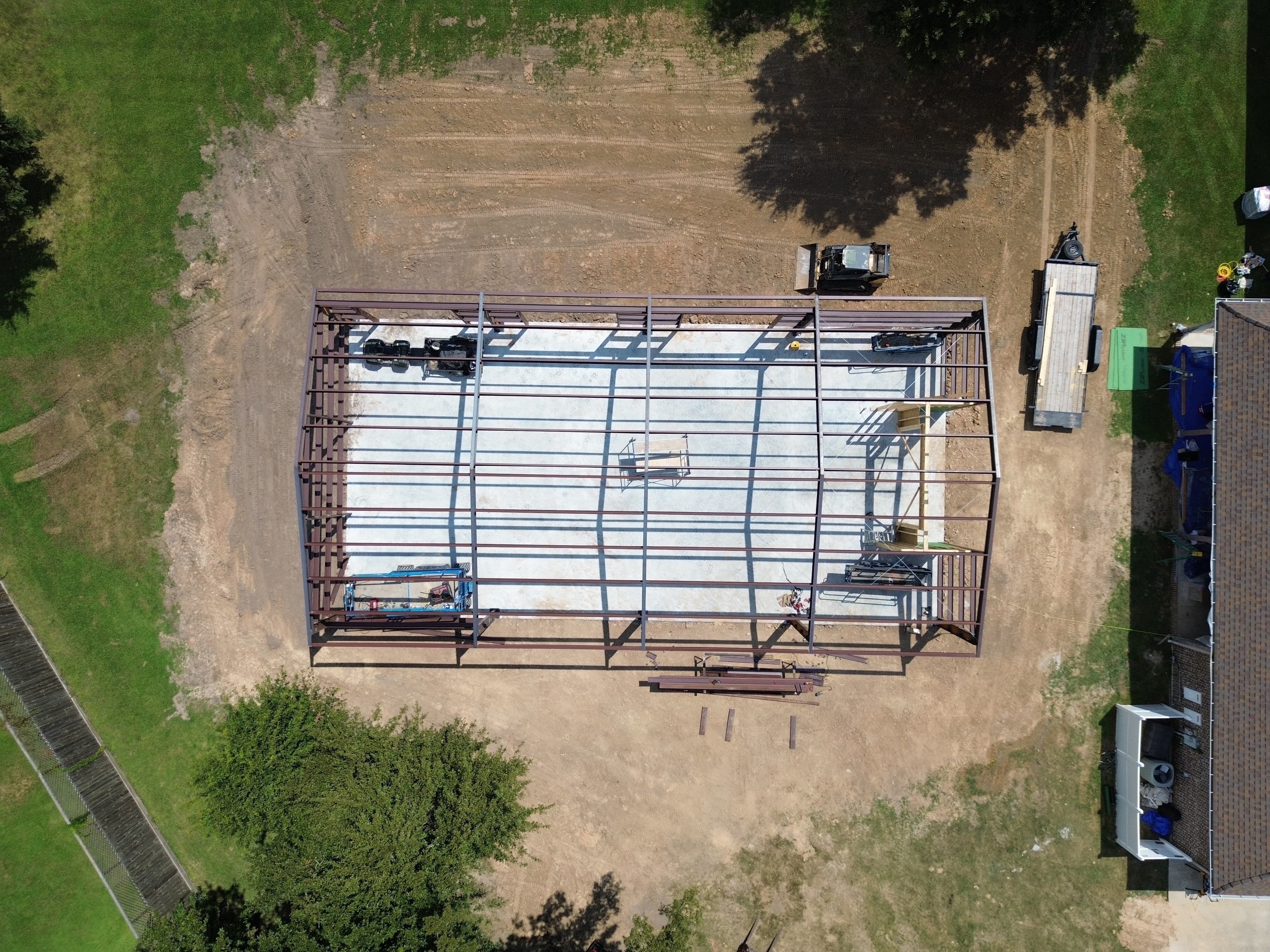 Aerial view of a steel frame anchored to a finished slab